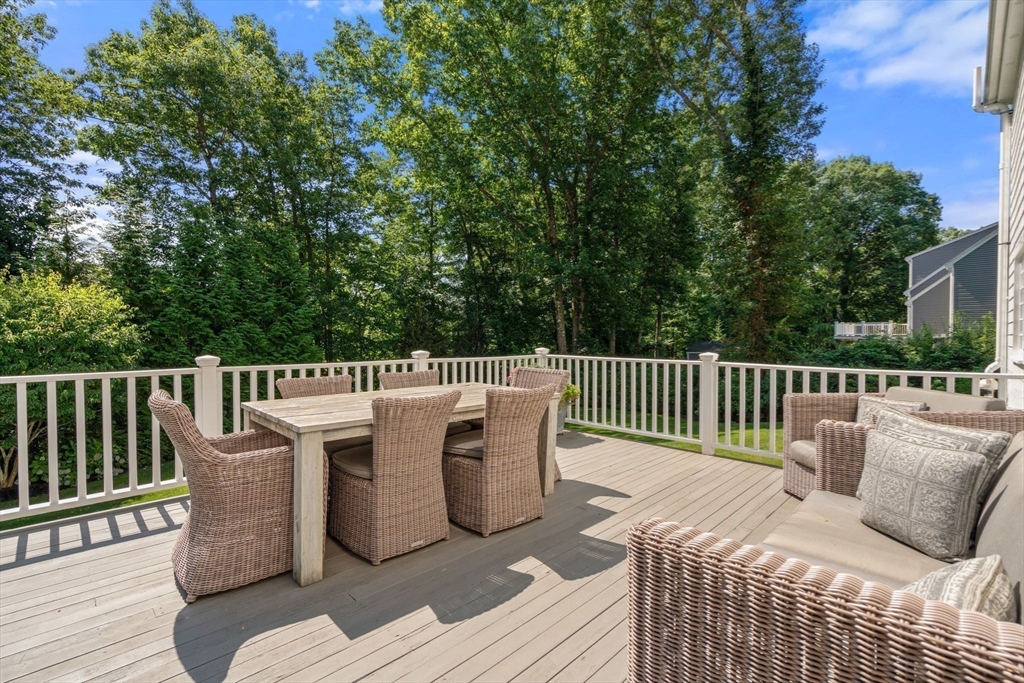 88 Albion Road Wellesley, MA 02481 - Photo 13 of 27 a view of a chair and table on the deck