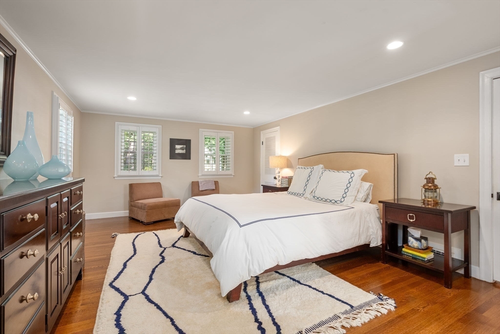 88 Albion Road Wellesley, MA 02481 - Photo 18 of 27 a bedroom with a bed and wooden floor