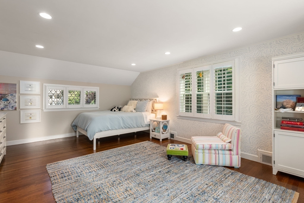 88 Albion Road Wellesley, MA 02481 - Photo 19 of 27 a bedroom with furniture and a wooden floor