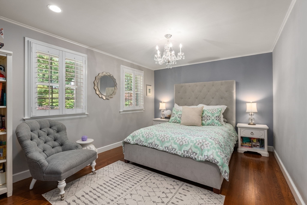 88 Albion Road Wellesley, MA 02481 - Photo 21 of 27 a bedroom with a bed and a couch