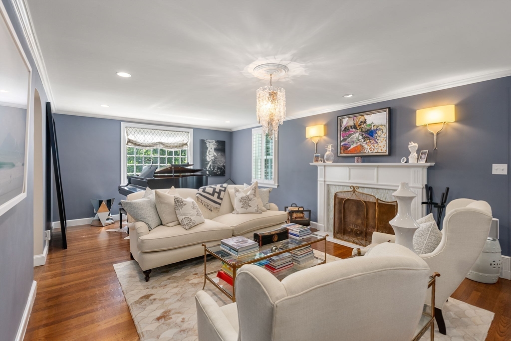 88 Albion Road Wellesley, MA 02481 - Photo 6 of 27 a living room with furniture a fireplace and a flat screen tv