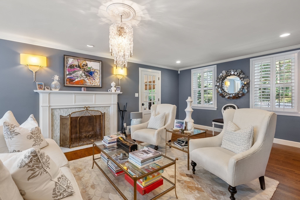 88 Albion Road Wellesley, MA 02481 - Photo 7 of 27 a living room with furniture a fireplace and a flat screen tv