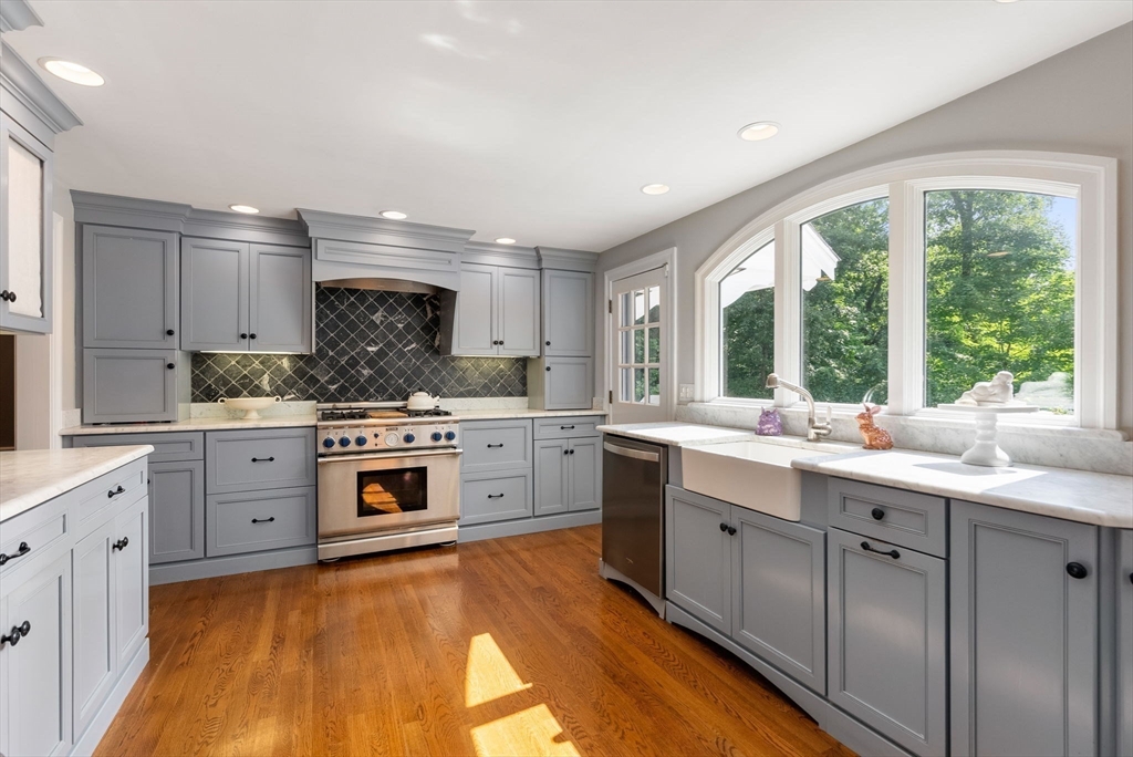 88 Albion Road Wellesley, MA 02481 - Photo 10 of 27 a kitchen with a sink stove and cabinets