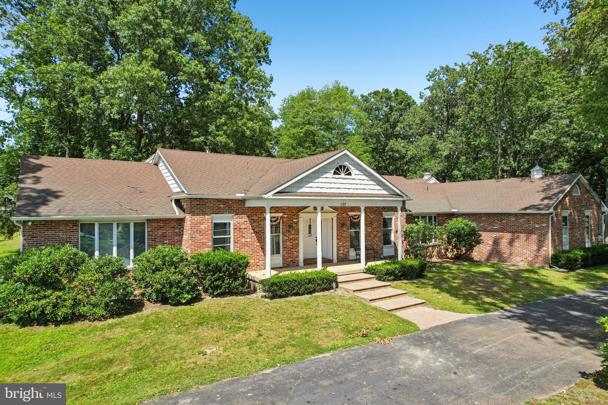 107 Phillips Road Mount Laurel, NJ 08054 - Photo 2 of 9 a front view of a house with a yard