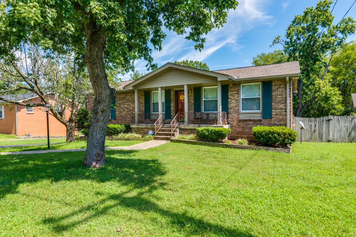 518 Rural Hill Road Nashville, TN 37217 - Photo 2 of 18 a front view of a house with garden and trees