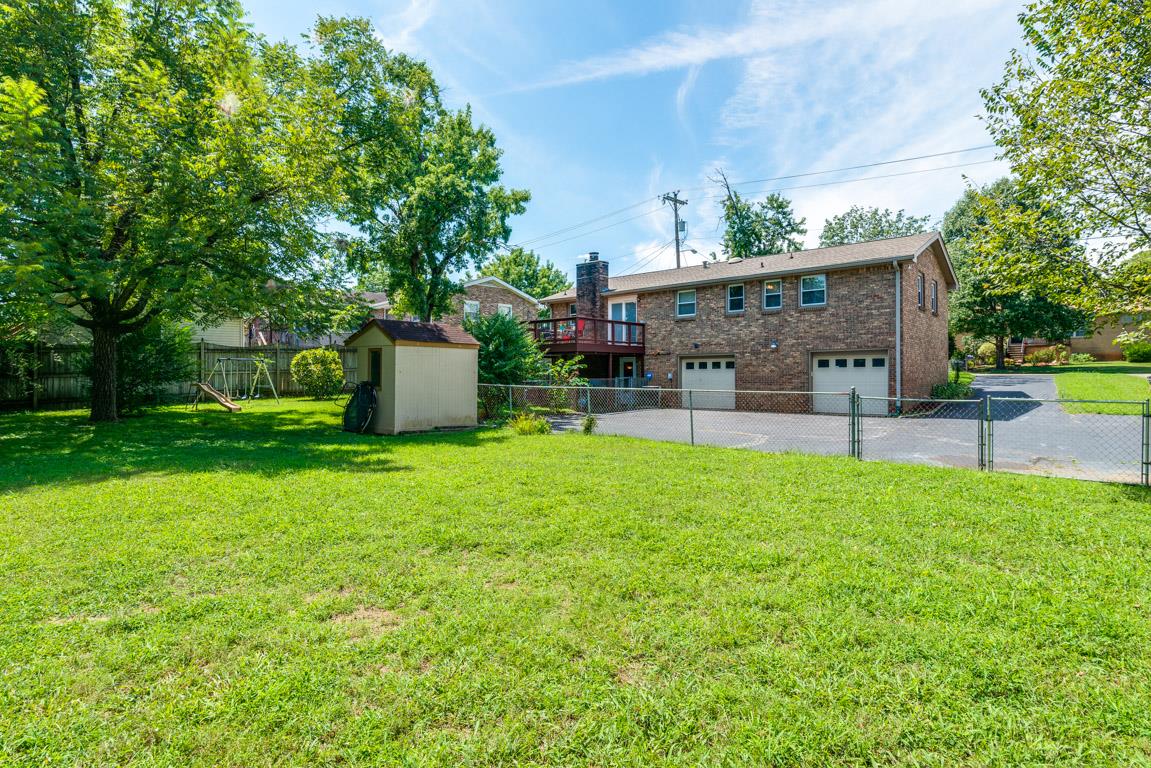 518 Rural Hill Road Nashville, TN 37217 - Photo 17 of 18 a view of a house with backyard and a tree