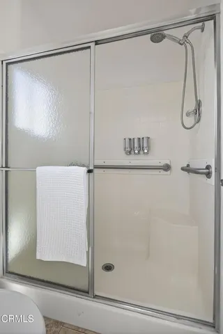 a bathroom with a sink vanity and mirror