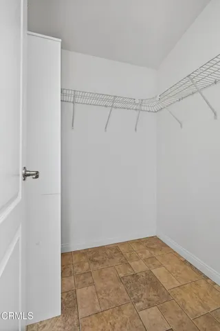 a bathroom with a double vanity sink mirror and shower