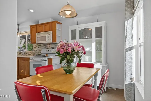 a kitchen with stainless steel appliances a stove sink and cabinets