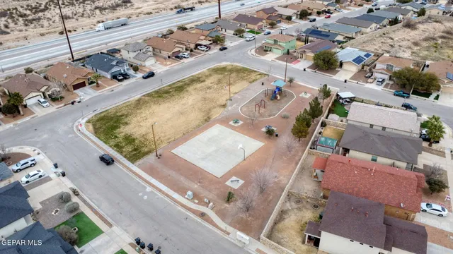 an aerial view of a house with a swimming pool