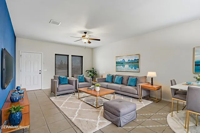 a living room with furniture and a flat screen tv