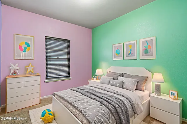 a bedroom with a bed and a dresser