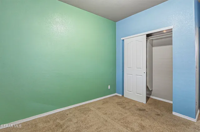 an empty room with closet