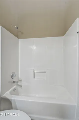 a bathroom with a sink toilet vanity and shower