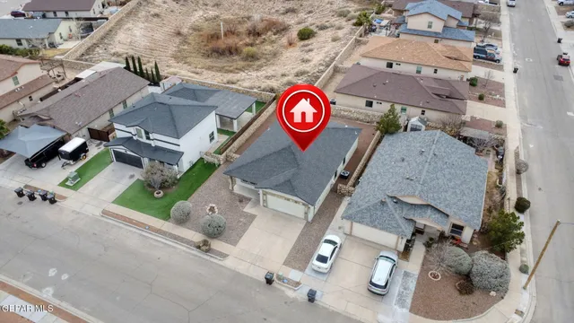 an aerial view of residential house with parking space