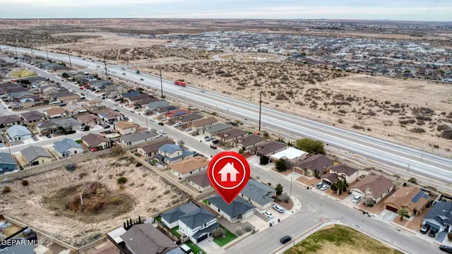 an aerial view of residential house and outdoor space