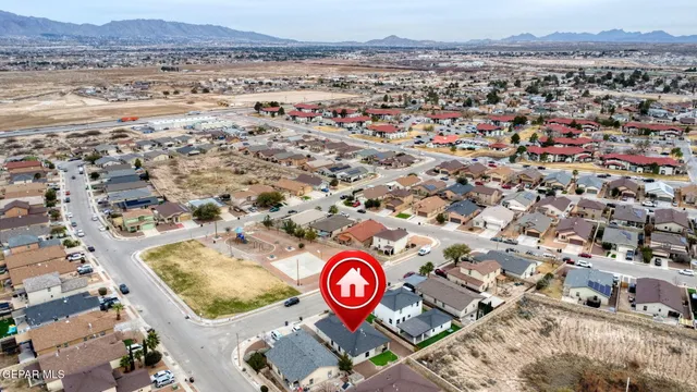 an aerial view of residential houses with outdoor space