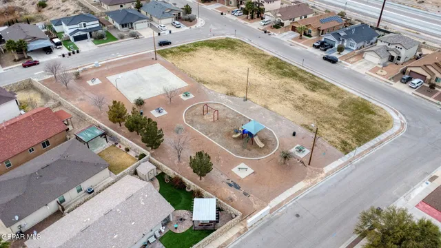 an aerial view of a house with a swimming pool
