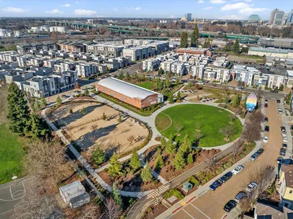 an aerial view of residential houses with outdoor space