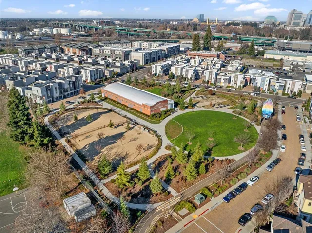 an aerial view of residential houses with outdoor space
