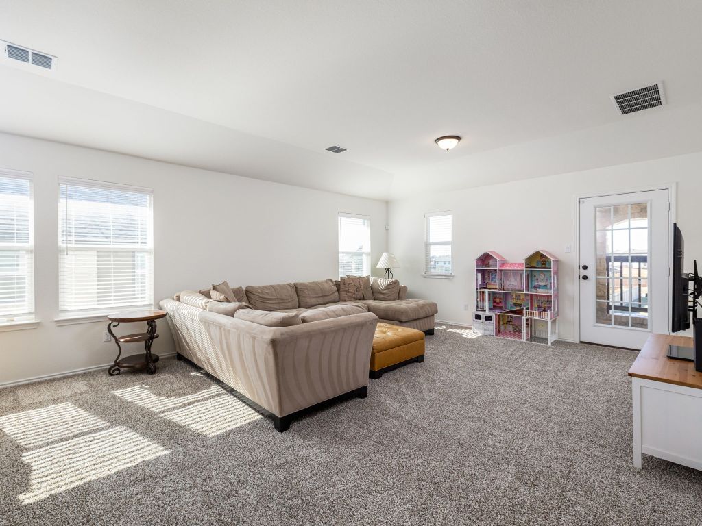 3921 Riardo Drive Round Rock, TX 78665 - Photo 18 of 27 a living room with furniture and a large window