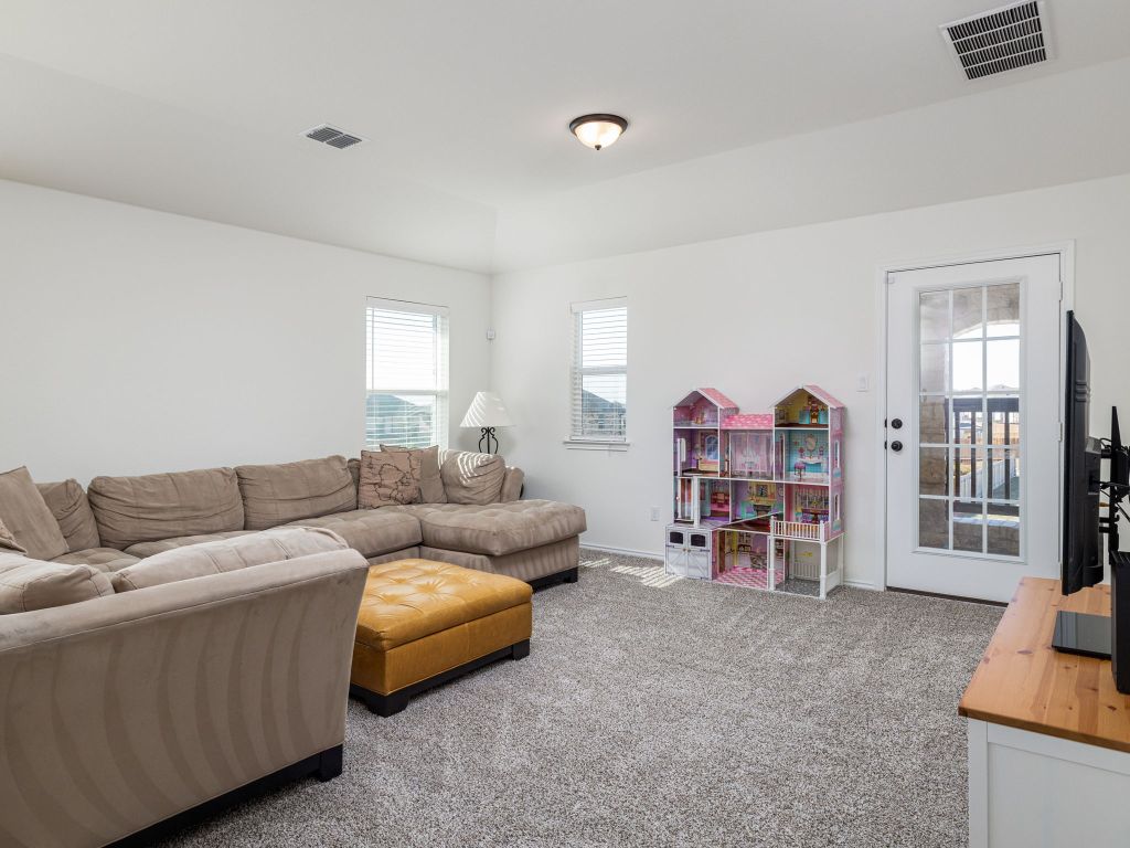 3921 Riardo Drive Round Rock, TX 78665 - Photo 19 of 27 a living room with furniture and a couch