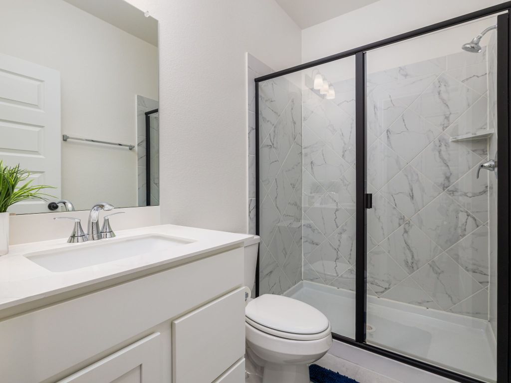 3921 Riardo Drive Round Rock, TX 78665 - Photo 24 of 27 a bathroom with a sink toilet and shower