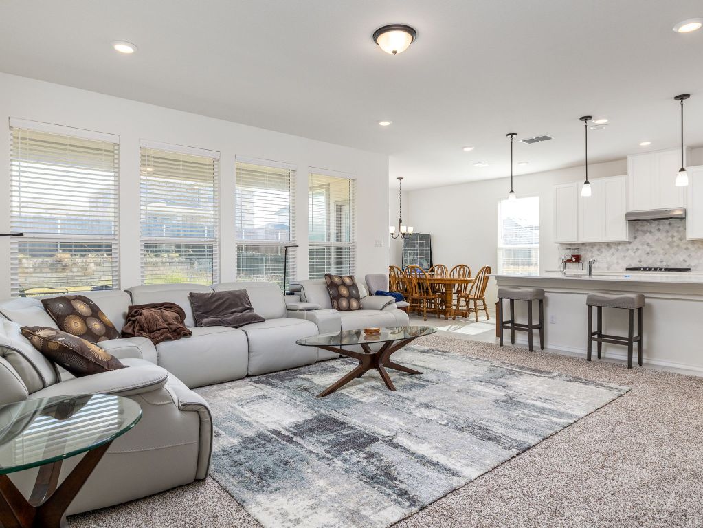 3921 Riardo Drive Round Rock, TX 78665 - Photo 4 of 27 Living room featuring light carpet and recessed lighting