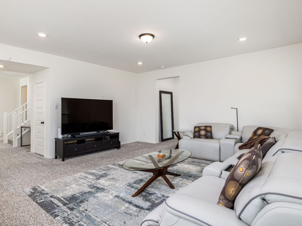 3921 Riardo Drive Round Rock, TX 78665 - Photo 6 of 27 a living room with furniture and a flat screen tv