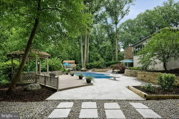 a view of a backyard with sitting area