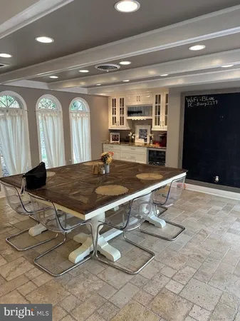 a room with gym equipment and view of living room