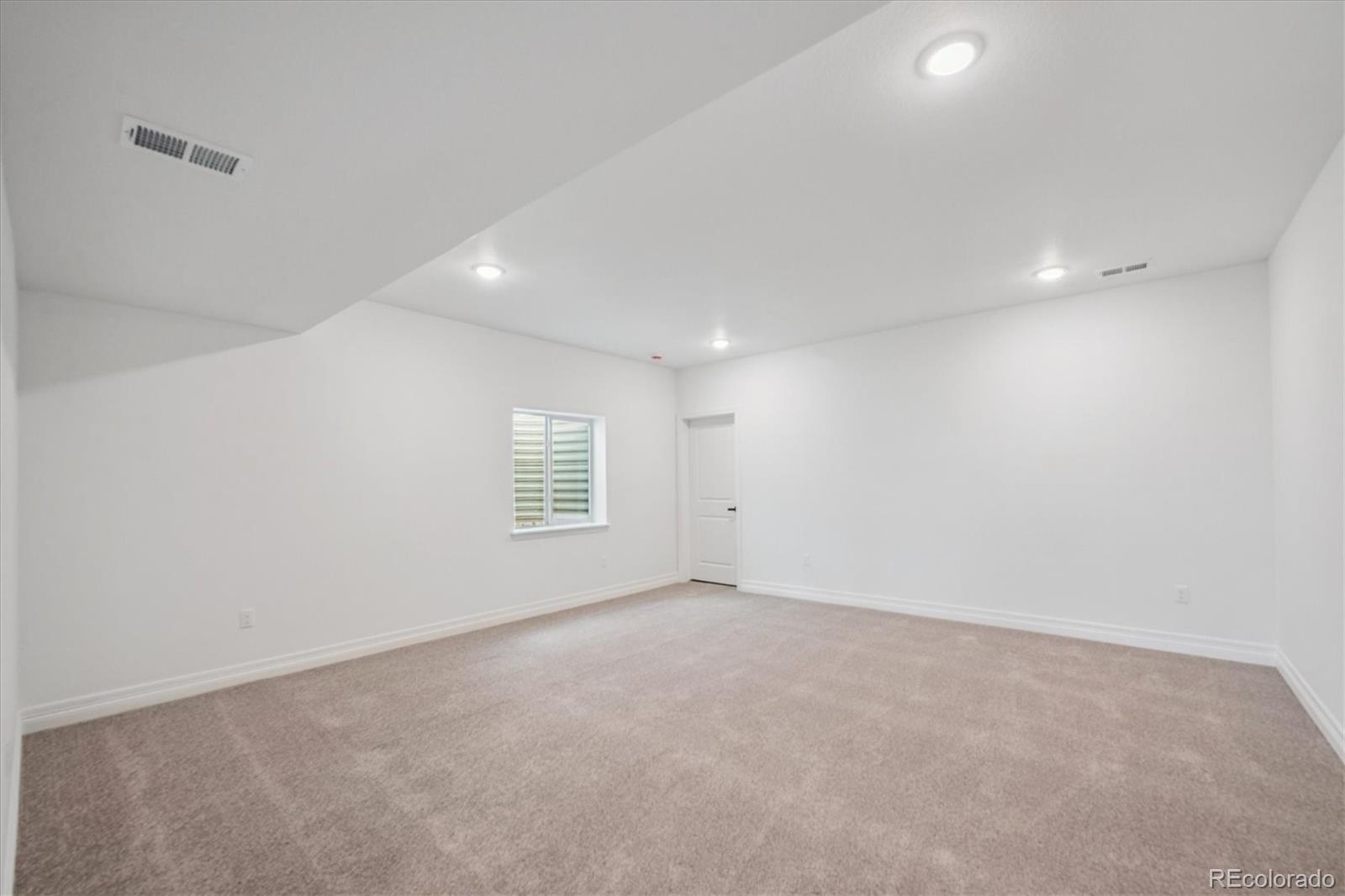 1180 Weller Street Timnath, CO 80547 - Photo 24 of 26 a view of an empty room with a window