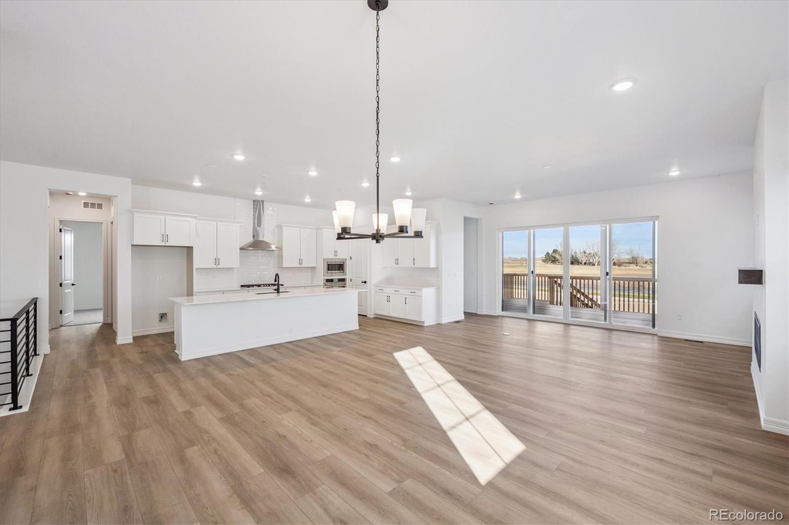1180 Weller Street Timnath, CO 80547 - Photo 8 of 26 a view of kitchen with kitchen island sink and center island