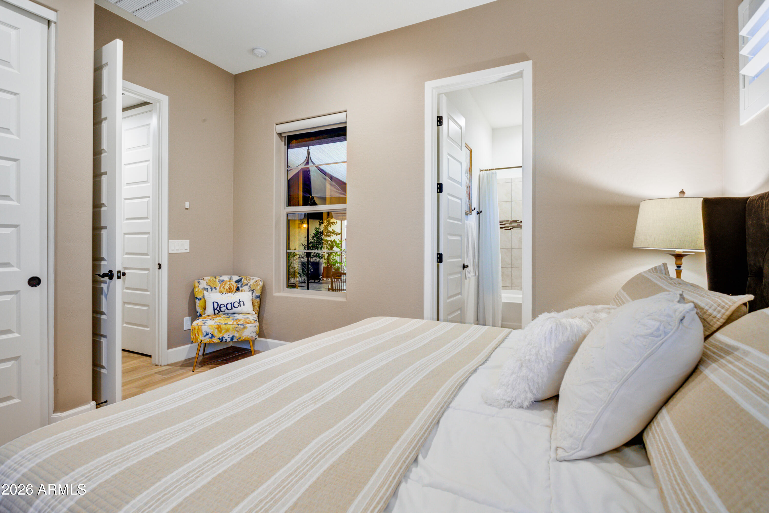 28517 North Camel Rock Court Rio Verde, AZ 85263 - Photo 19 of 39 a bedroom with a bed and a large mirror