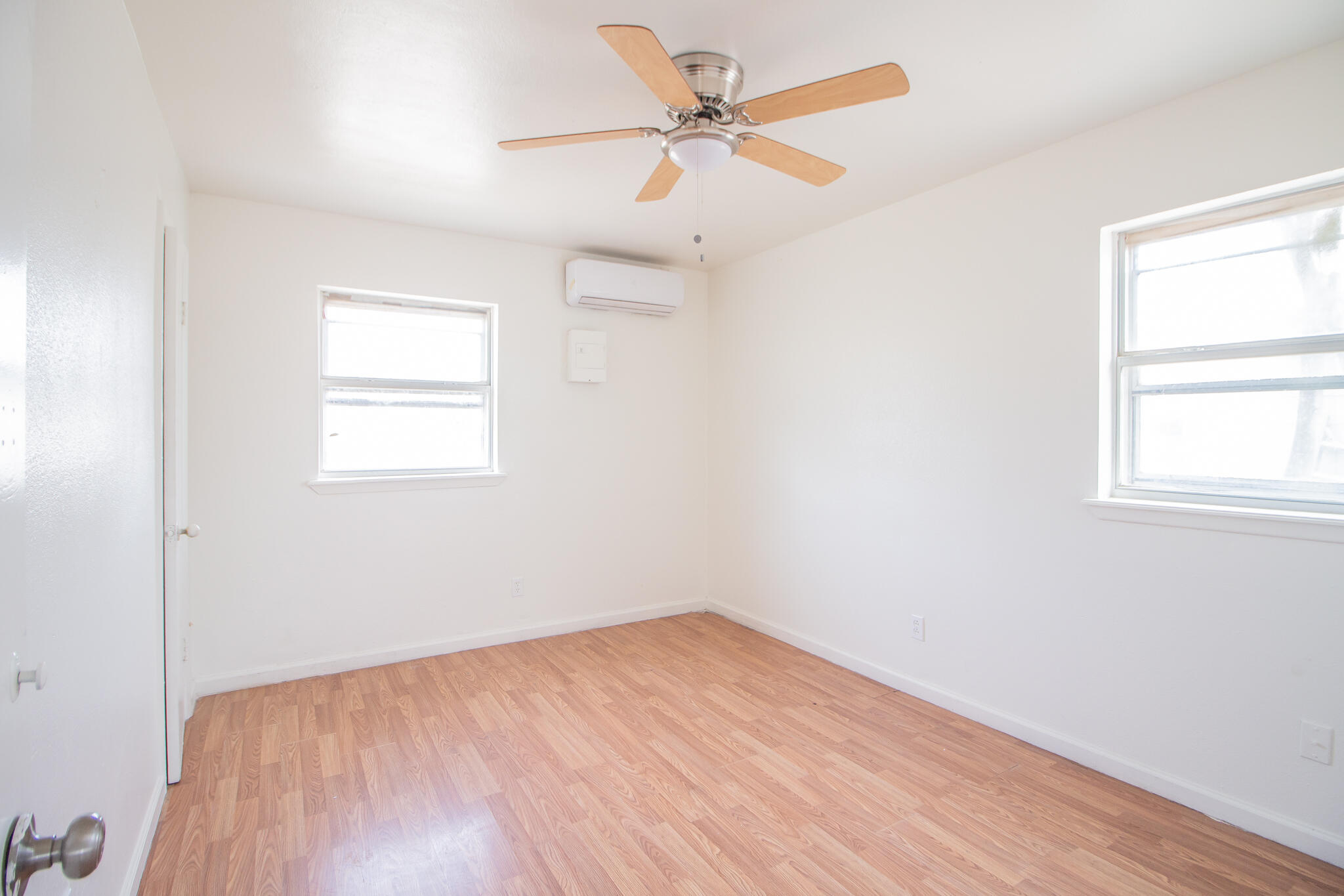 3304 Itasca Street Lubbock, TX 79415 - Photo 13 of 18 an empty room with a window and a ceiling fan