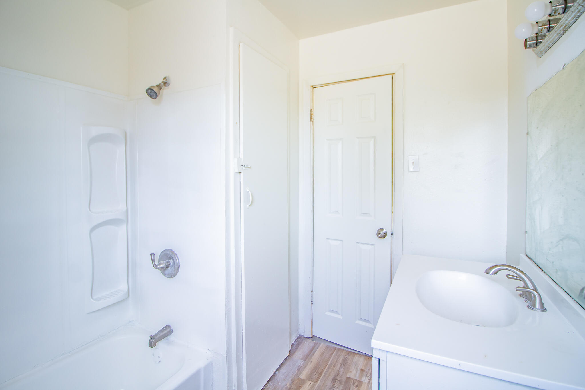 3304 Itasca Street Lubbock, TX 79415 - Photo 15 of 18 a bathroom with a sink and shower