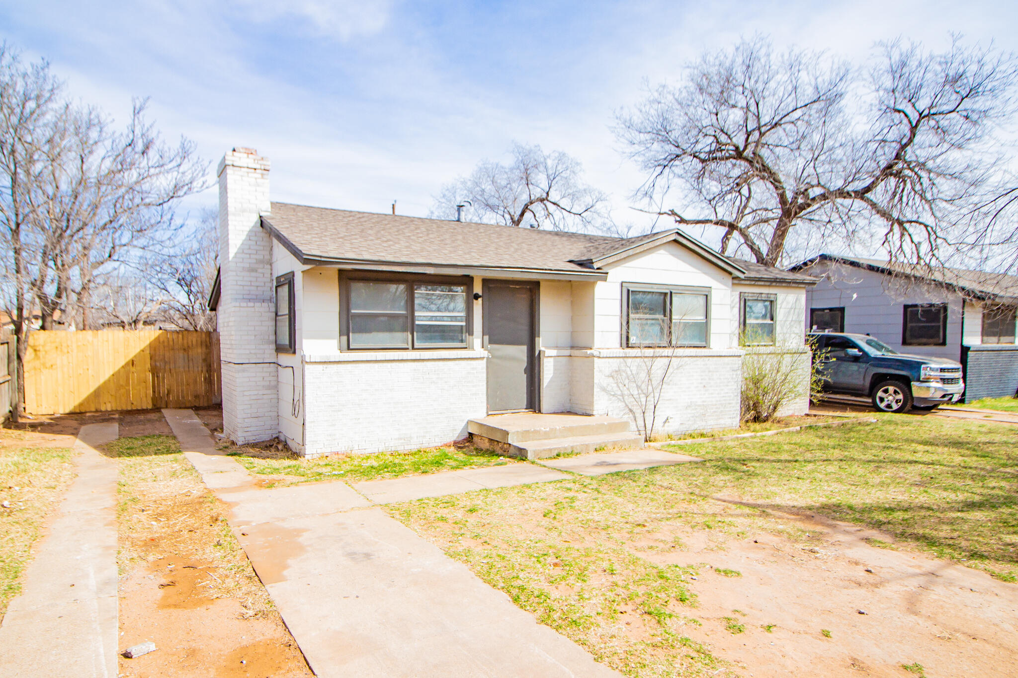 3304 Itasca Street Lubbock, TX 79415 - Photo 2 of 18 a view of a house with snow on the background