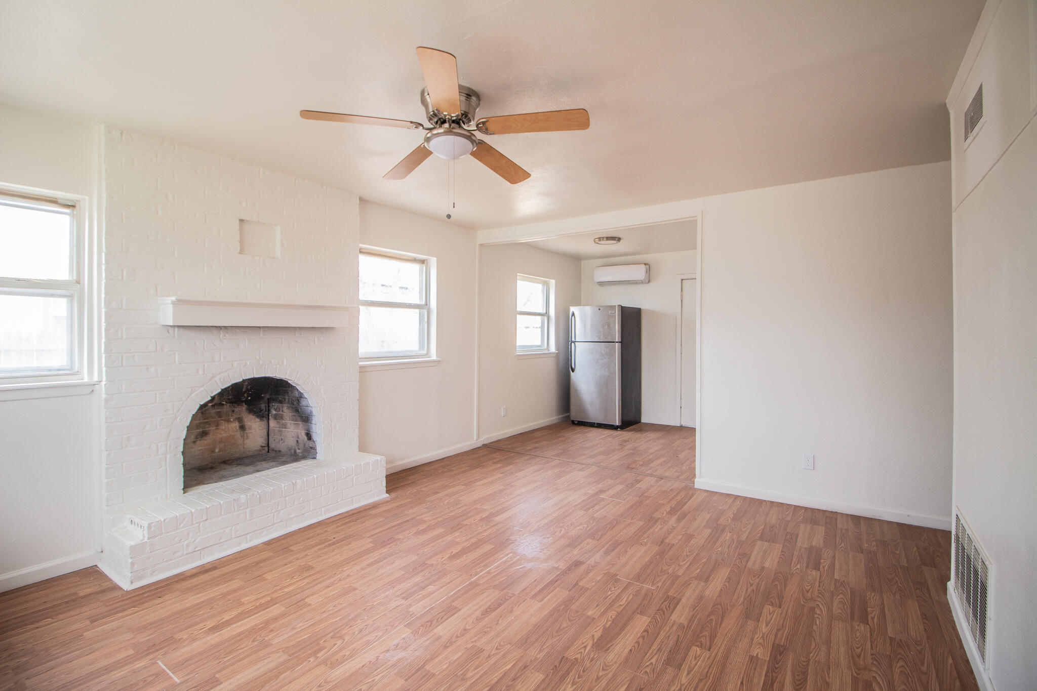 3304 Itasca Street Lubbock, TX 79415 - Photo 3 of 18 a room with window and ceiling fan