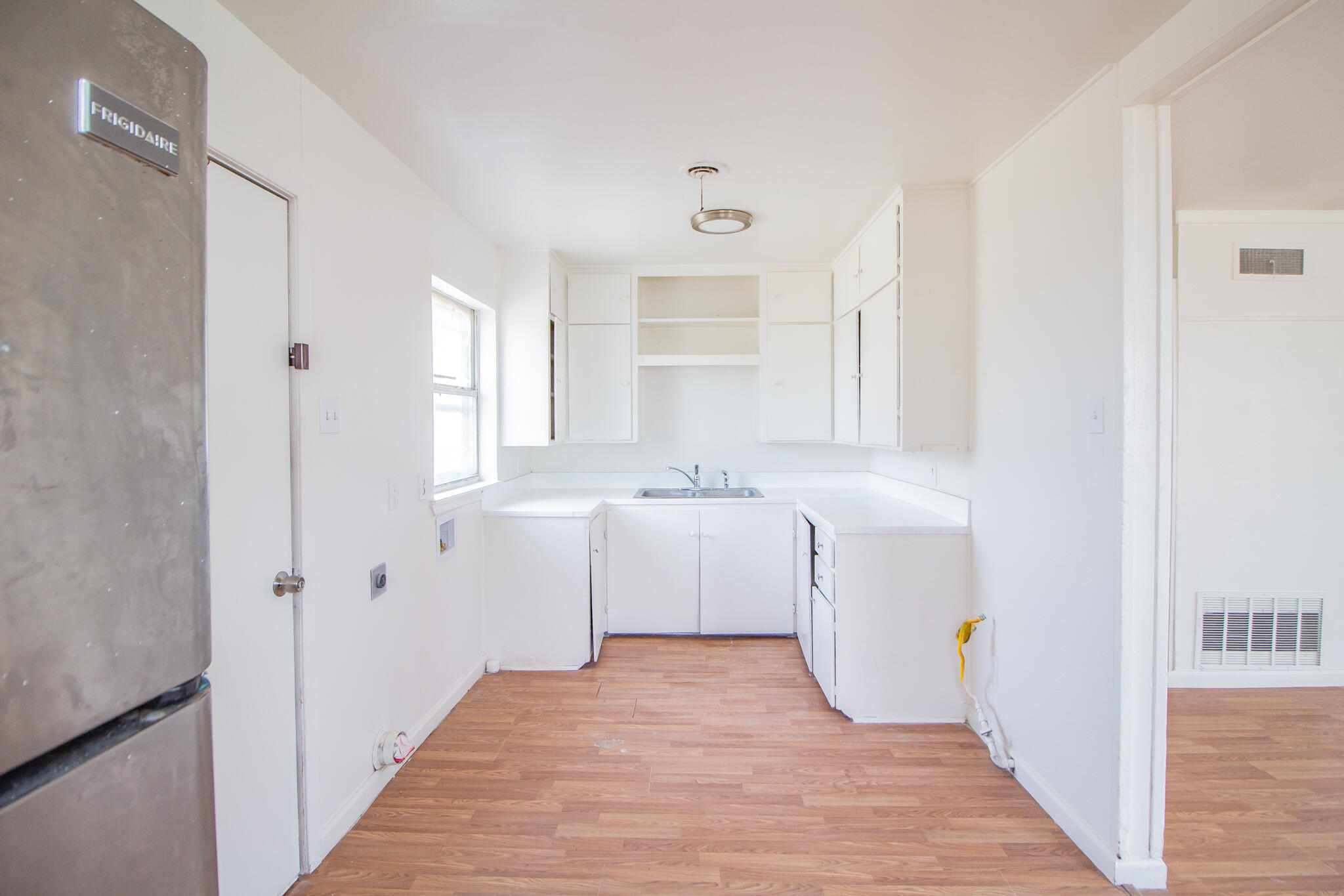 3304 Itasca Street Lubbock, TX 79415 - Photo 8 of 18 a bathroom with a sink a toilet and a mirror