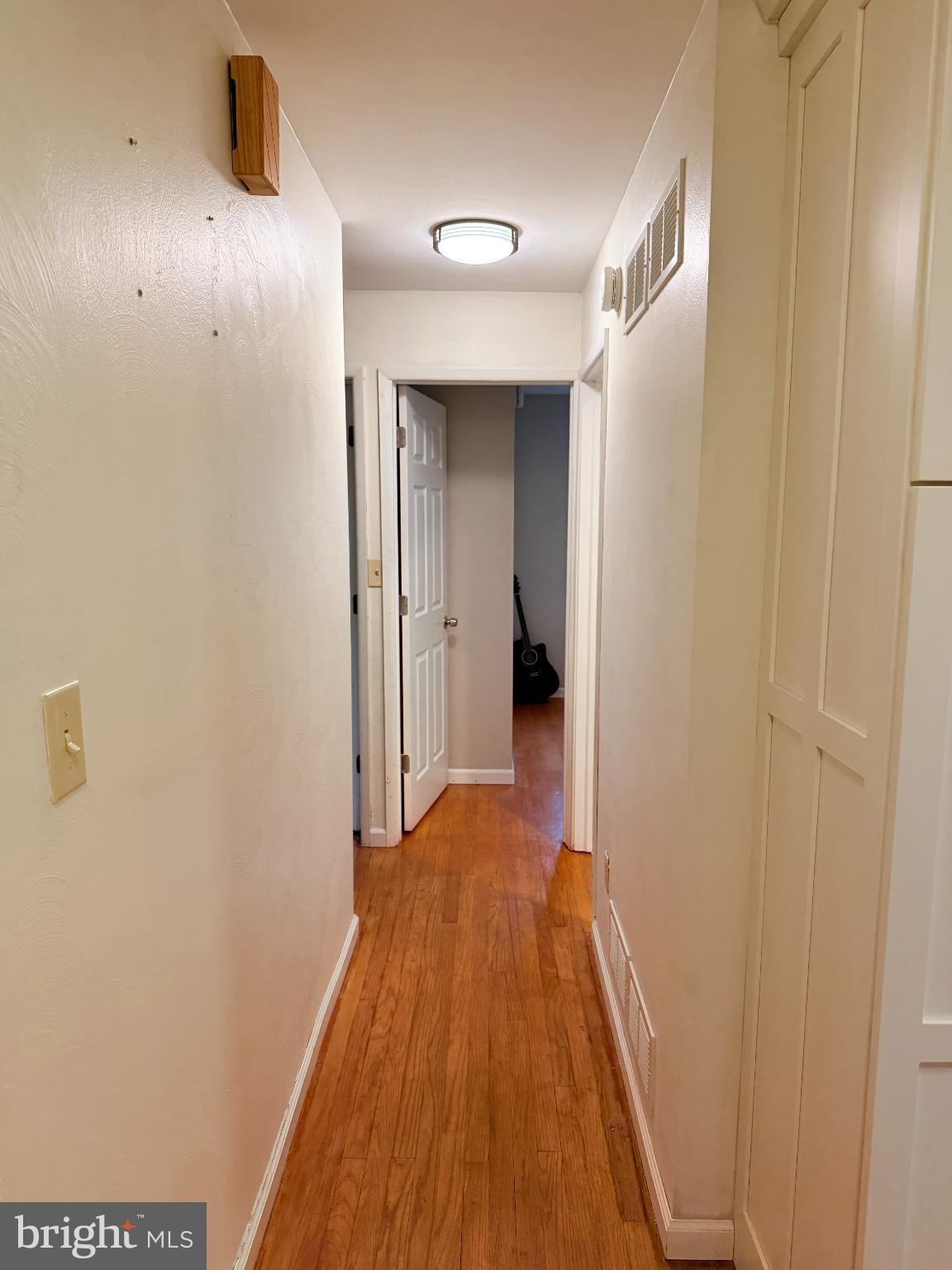 242 Spring Street State College, PA 16801 - Photo 28 of 73 Inviting hallway with warm wooden floors.
