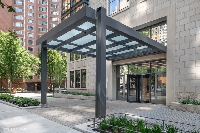 61 East Banks Street, Unit 802 Chicago, IL 60610 - Photo 15 of 23 a front view of a building with street view