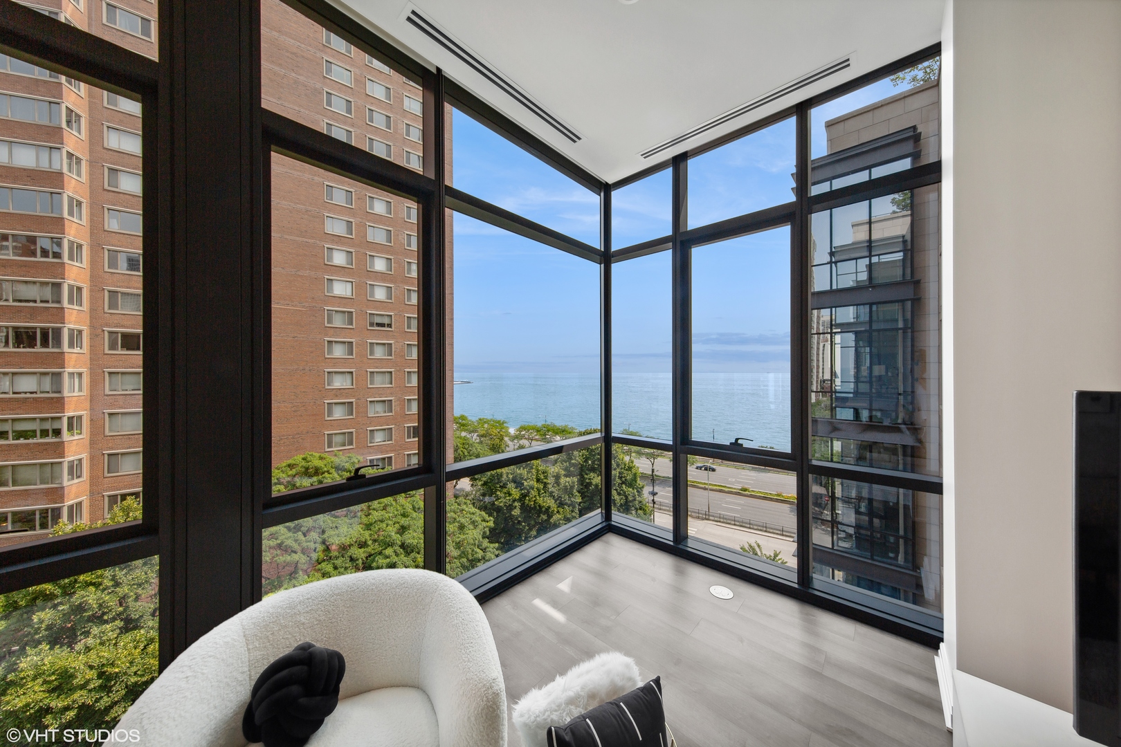61 East Banks Street, Unit 802 Chicago, IL 60610 - Photo 4 of 23 a view of a living room and a large window