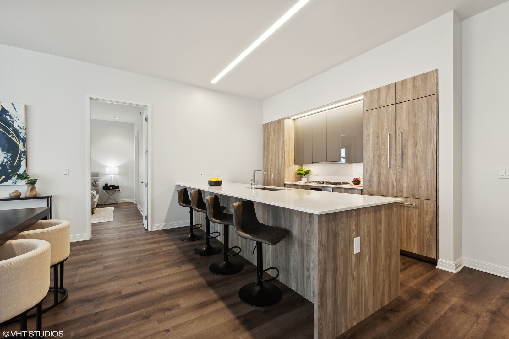 61 East Banks Street, Unit 802 Chicago, IL 60610 - Photo 8 of 23 a kitchen with a sink cabinets and wooden floor