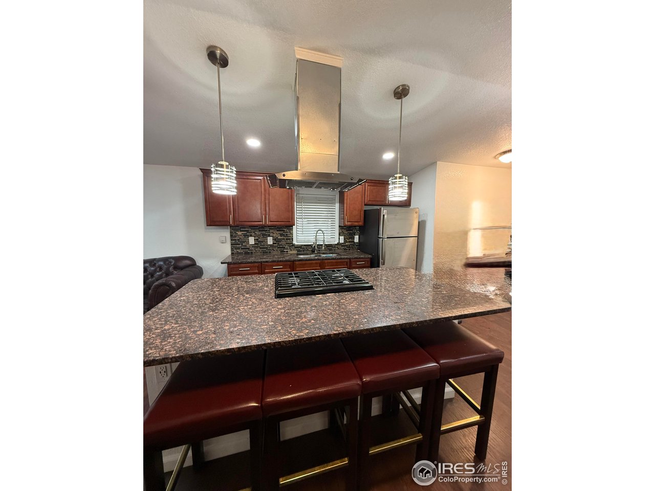 9775 Lark Street Federal Heights, CO 80260 - Photo 3 of 17 a kitchen with a table and chairs
