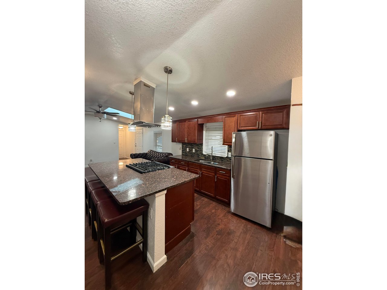 9775 Lark Street Federal Heights, CO 80260 - Photo 4 of 17 a kitchen with a sink cabinets and stainless steel appliances