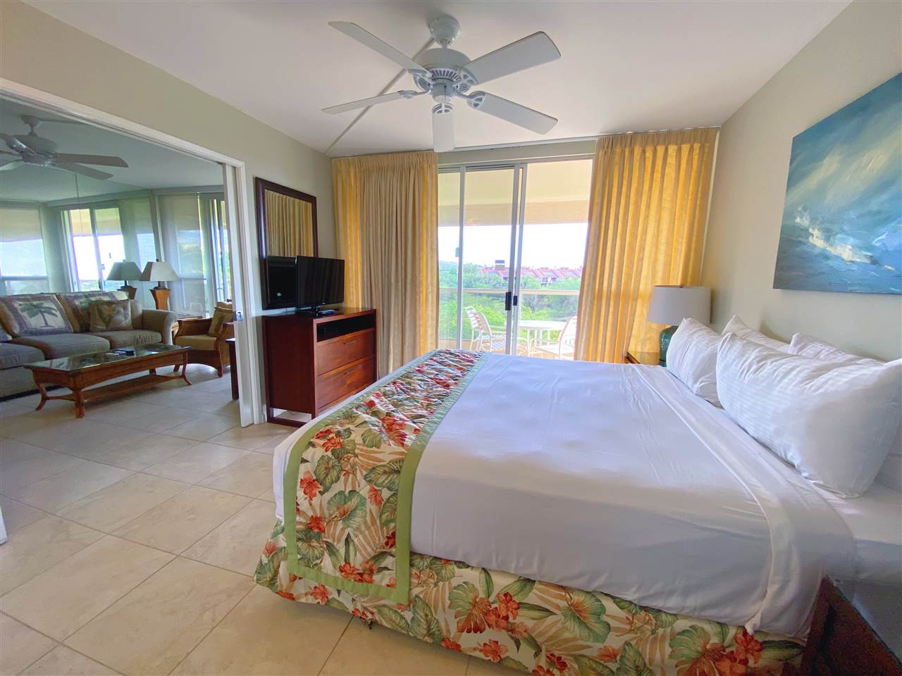 2575 South Kihei Road, Unit Q401/401A Kihei, HI 96753 - Photo 12 of 25 a bedroom with a bed and large windows