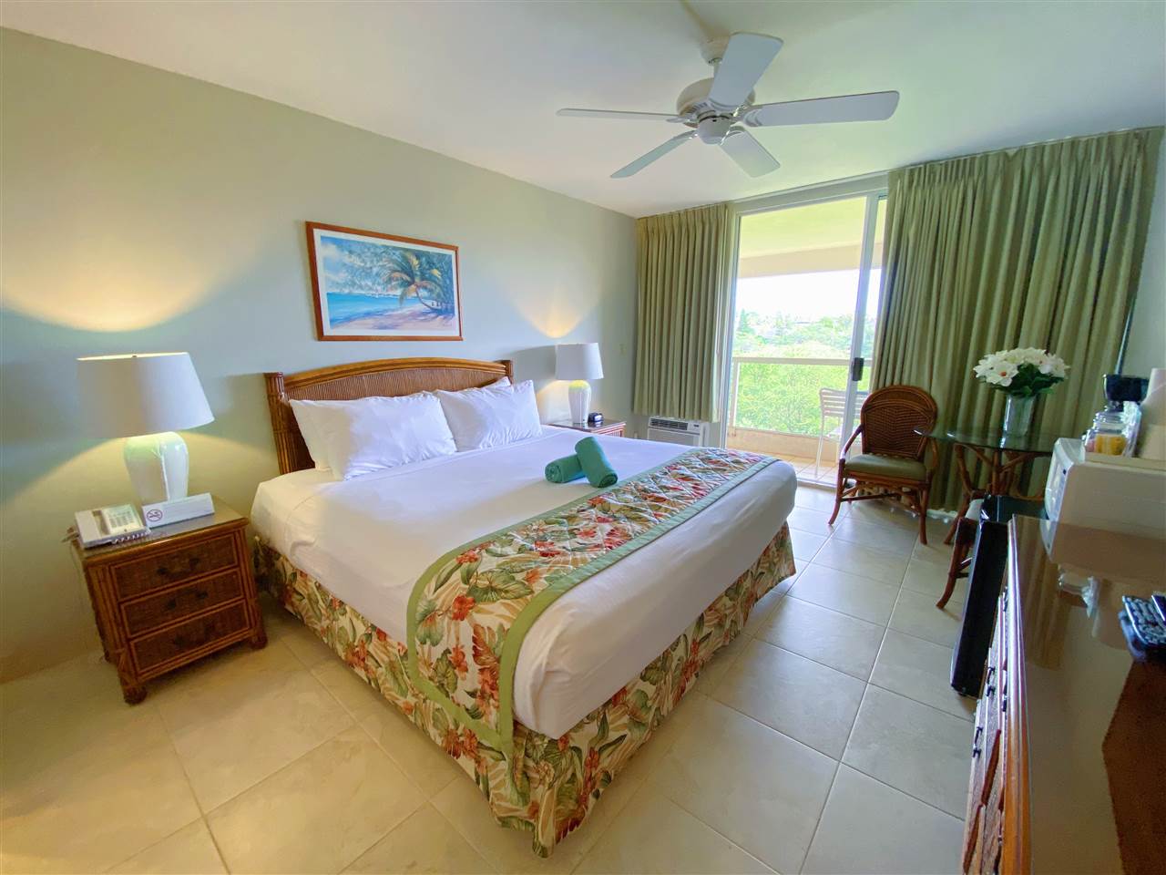 2575 South Kihei Road, Unit Q401/401A Kihei, HI 96753 - Photo 14 of 25 a bed room with a bed and a chandelier