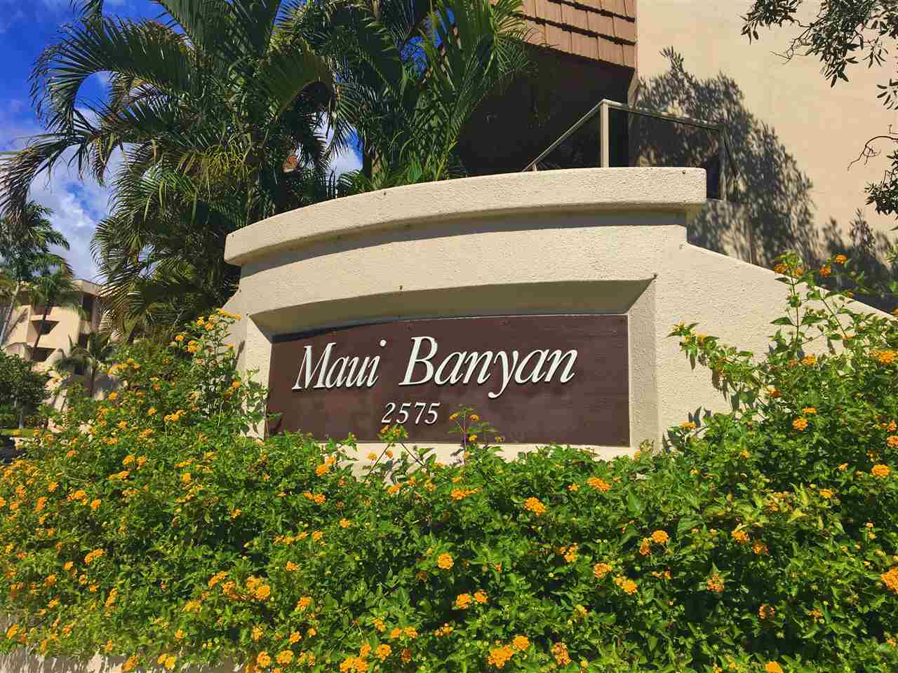 2575 South Kihei Road, Unit Q401/401A Kihei, HI 96753 - Photo 22 of 25 a view of outdoor space with signage and flags