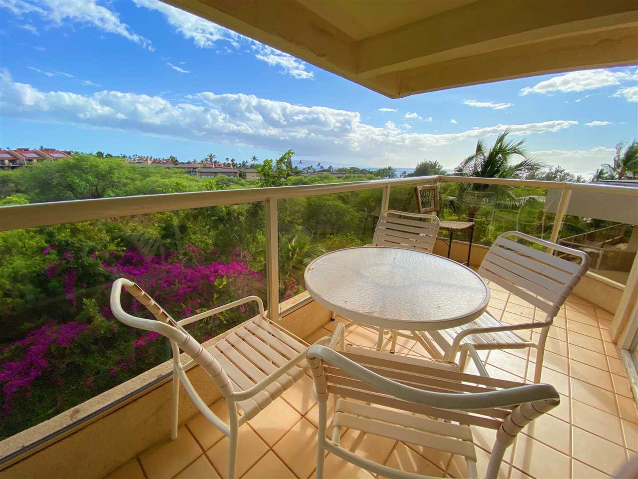 2575 South Kihei Road, Unit Q401/401A Kihei, HI 96753 - Photo 3 of 25 a terrace with outdoor seating and city view