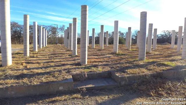 a view of dirt yard with mountain view